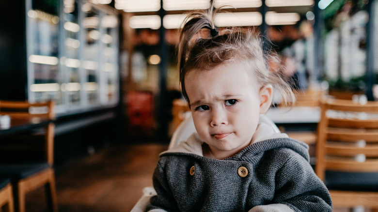 Cranky child in a restaurant