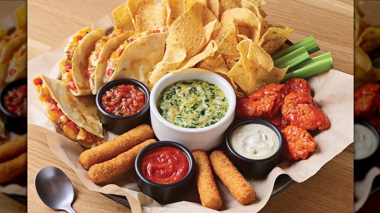 Applebee's appetizer combo of spinach dip, mozarella sticks, and boneless wings