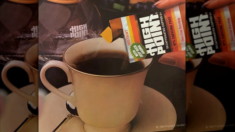 mirrored image of closeup of vintage High Point poster, a hand pours instant sachet into cup