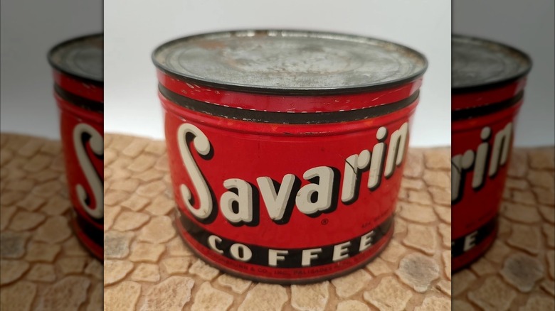 vintage can of Savarin Coffee on brown table mirrored image