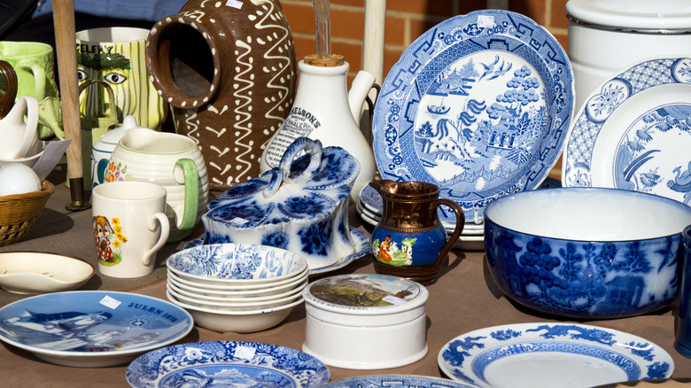 China displayed on table at an outdoor thrift market