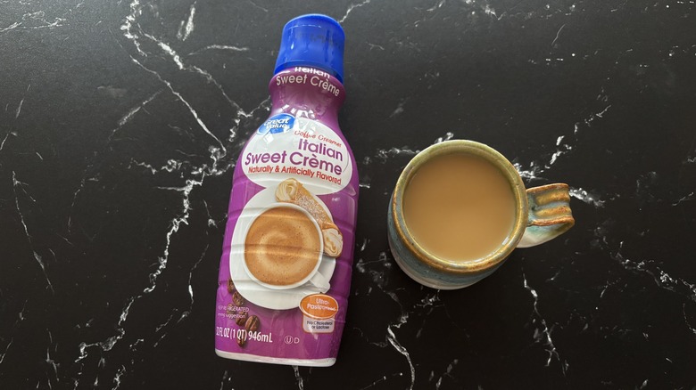 Great Value Italian sweet creme creamer bottle next to cup of coffee