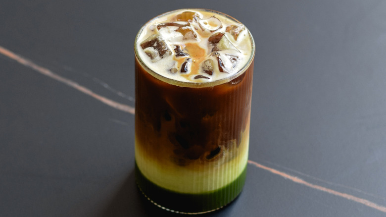 Iced dirty matcha latte with coffee