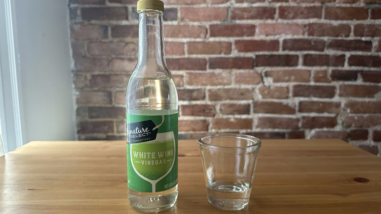 Signature Select White Wine Vinegar on wooden table
