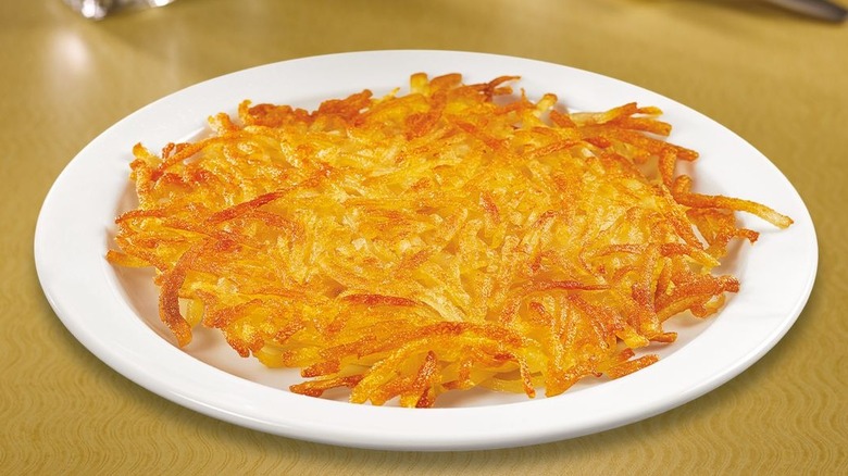 Denny's hash browns on white plate