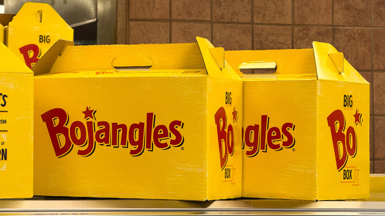 A pair of Bojangles to-go containers on a shelf
