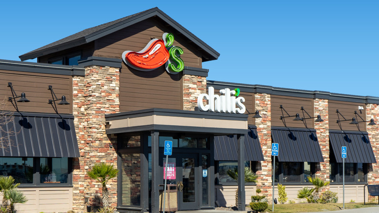 Exterior of a Chili's restaurant front entrance and signs