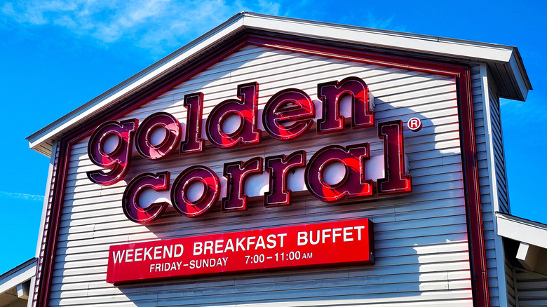 Sign on the front of Golden Corral store on a sunny day