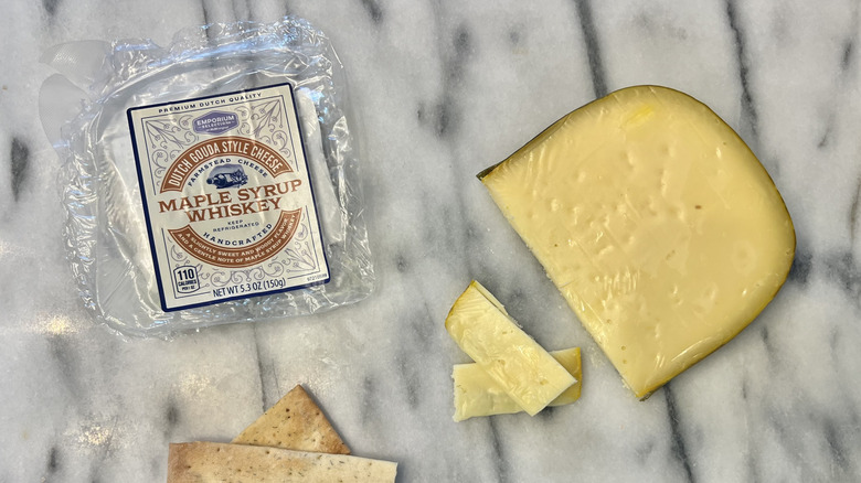 Aldi Maple Syrup Whiskey Dutch Gouda cheese cut on cheese board.