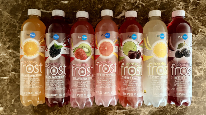 Overhead shot of Aldi PurAqua Sparkling Frost Water bottles lined up in a row