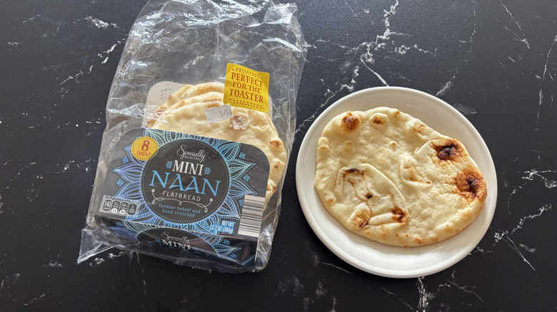 Aldi Specially Selected mini naan package with one naan served on a plate next to it