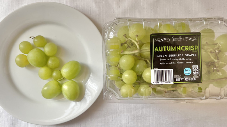 Box of grapes and fruit on a plate