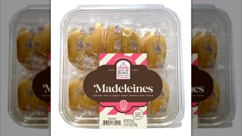 Madeleine cookies in plastic container