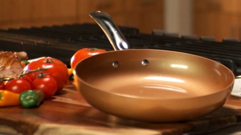copper chef 360 pan on board in promo shot