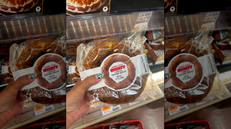 Hand holding package of Trader Joe's Simit Turkish Sesame Bread at store