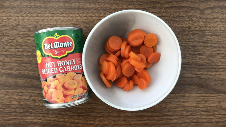 Del Monte canned hot honey sliced carrots in a bowl.