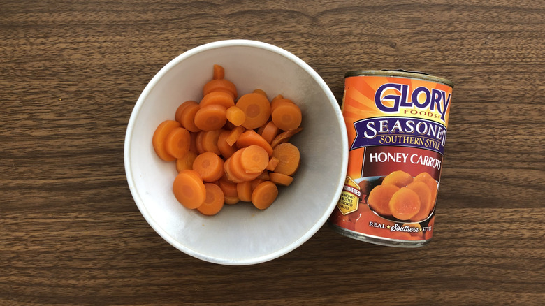 Glory Foods canned seasoned southern style honey carrots in a bowl.