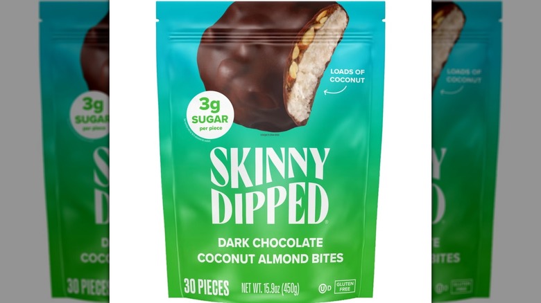 Green and blue bag of SkinnyDipped Dark Chocolate Coconut Almond Bites