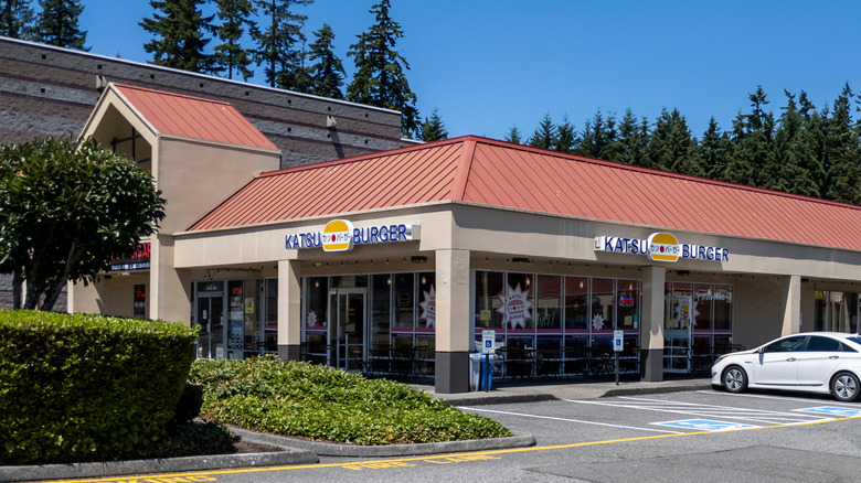 Katsu Burger exterior with West Coast fast food chain sign and parking lot