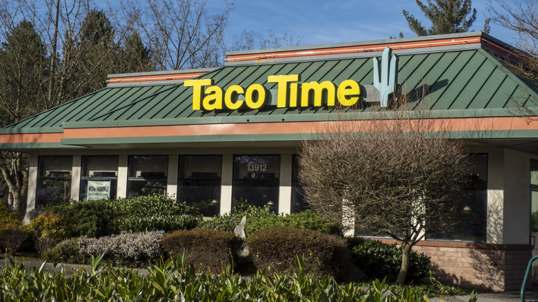 Taco Time West Coast fast food chain sign and exterior against a blue sky