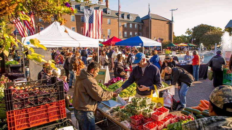 A farmers market with an American flag