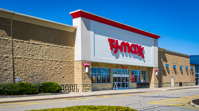 The facade and front door of the T.J. Maxx department store against blue sky