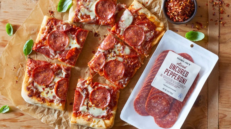 Sliced Uncured Pepperoni package next to a pizza