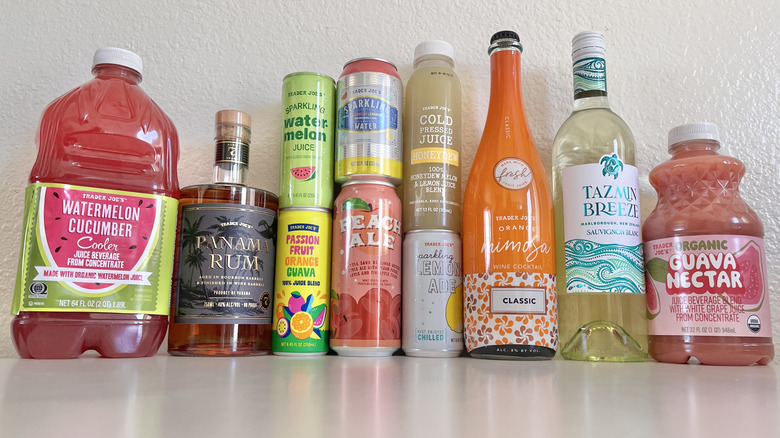 Various Trader Joe's drinks stacked on a table