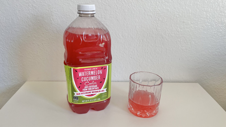 An bottle and glass of Trader Joe's Watermelon Cucumber Cooler on a table