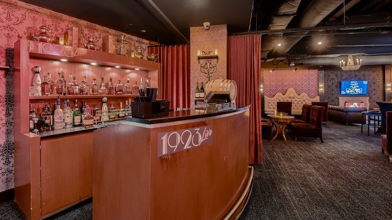 Interior of 1923 Prohibition with tables, bar, and shelves
