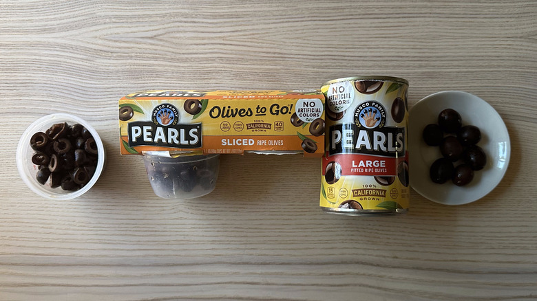 Musco Family Pearls black olives on small white plates