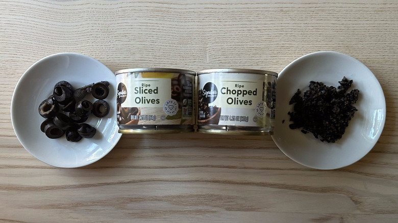 Signature Select black olives on small white plates