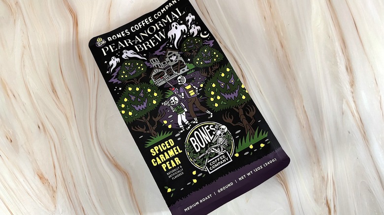 Bag of Pear-anormal Brew Bones Coffee on marble surface