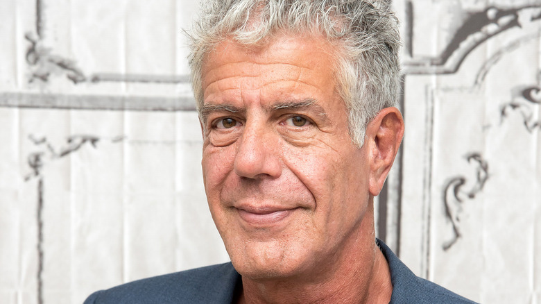 A close-up shot of Anthony Bourdain's face