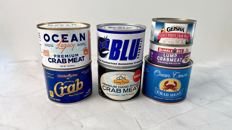 7 canned crabmeat brand on a white table.