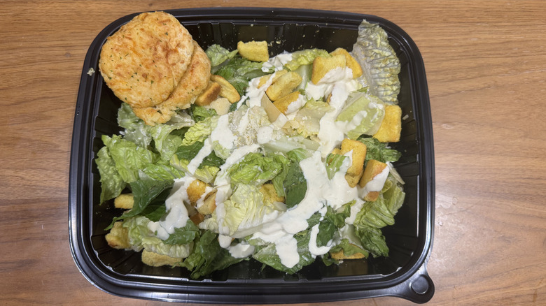 Red Lobster's classic Caesar salad on a wooden surface.