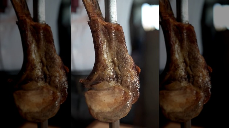 Double Cut Pork Chop at Fogo de Chao on metal stick
