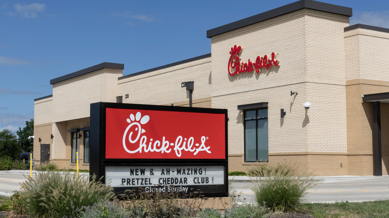 Chick-fil-a restaurant with red pretzel cheddar club sign