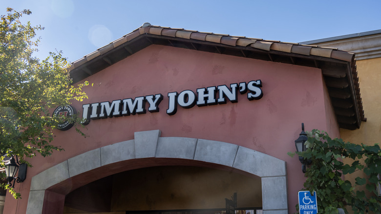 Jimmy John's logo on the front of a red and yellow building