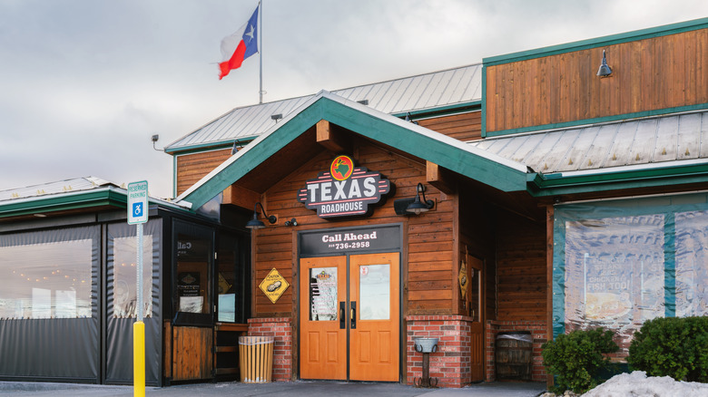 A restaurant with a 'Texas Roadhouse' sign on the front