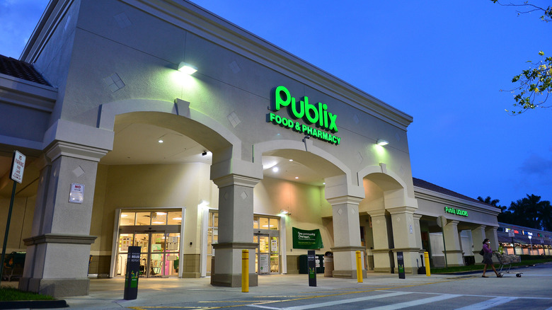 Publix store with lit-up sign at dusk