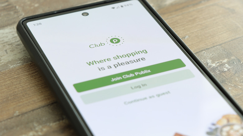 Club Publix app on phone on table