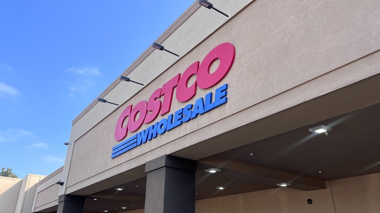 Costco Wholesale sign against blue sky