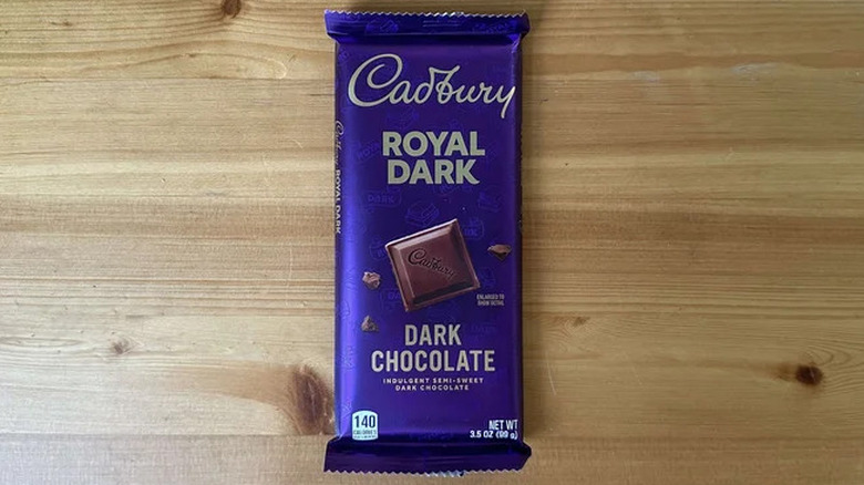 Overhead shot of Cadbury Royal Dark chocolate bar on wooden surface