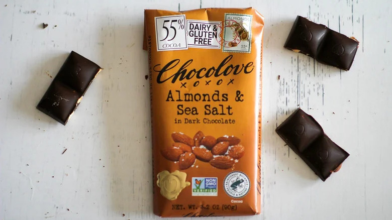Overhead shot of Chocolove almonds and sea salt bar alongside several pieces of chocolate
