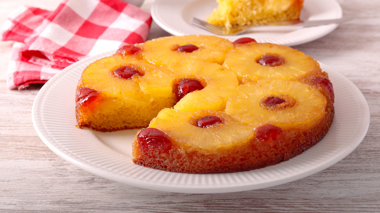 Pineapple upside down cake on white plate