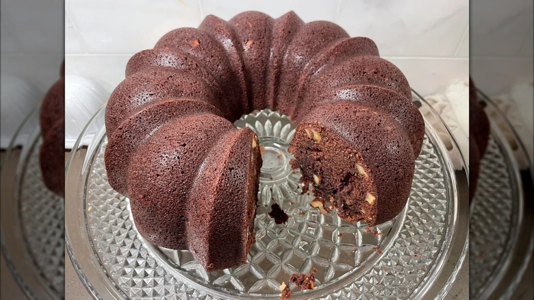 Cut tunnel of fudge cake on glass plate
