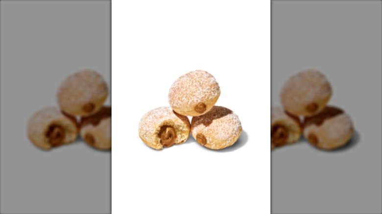 Three CosMc's Cookie Butter McPops against a white background