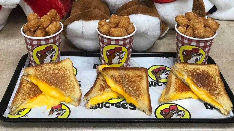 Three Buc-ee's grilled cheeses with tator tots.