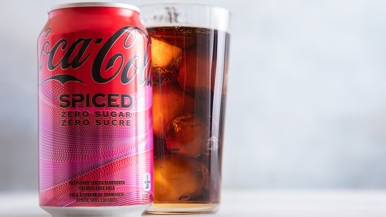 Can of Coca-Cola Spiced next to glass